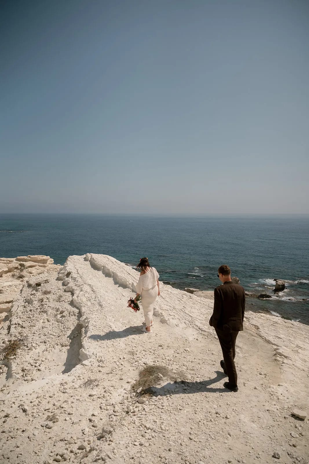 Couple on white cliffs with ocean view