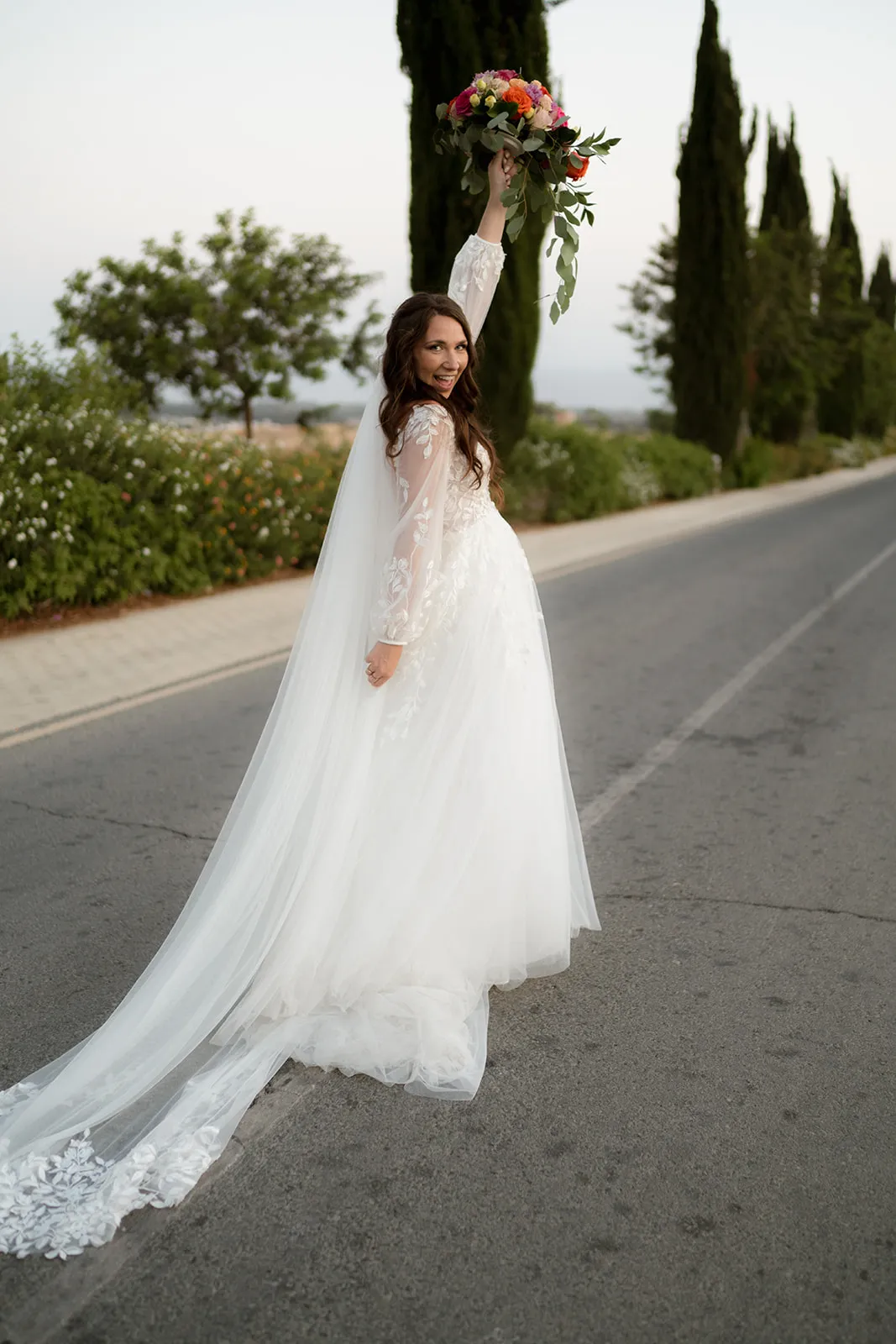 Bride with bouquet on road — Cyprus wedding photography