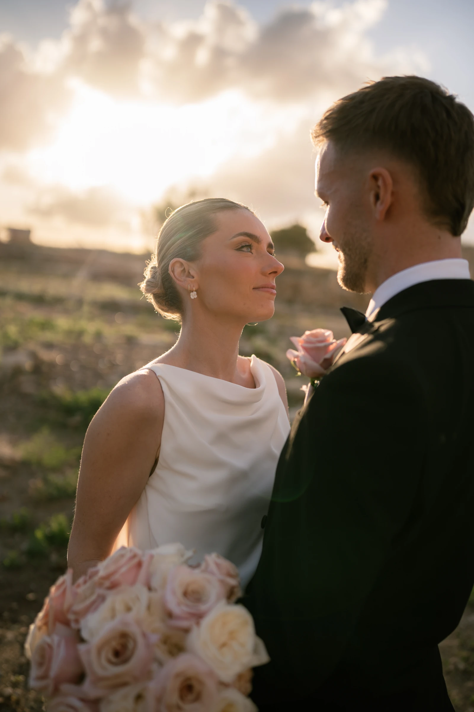 Sunset portrait of bride looking at groom at Liopetro Wedding Venue, Kouklia, Paphos, Cyprus